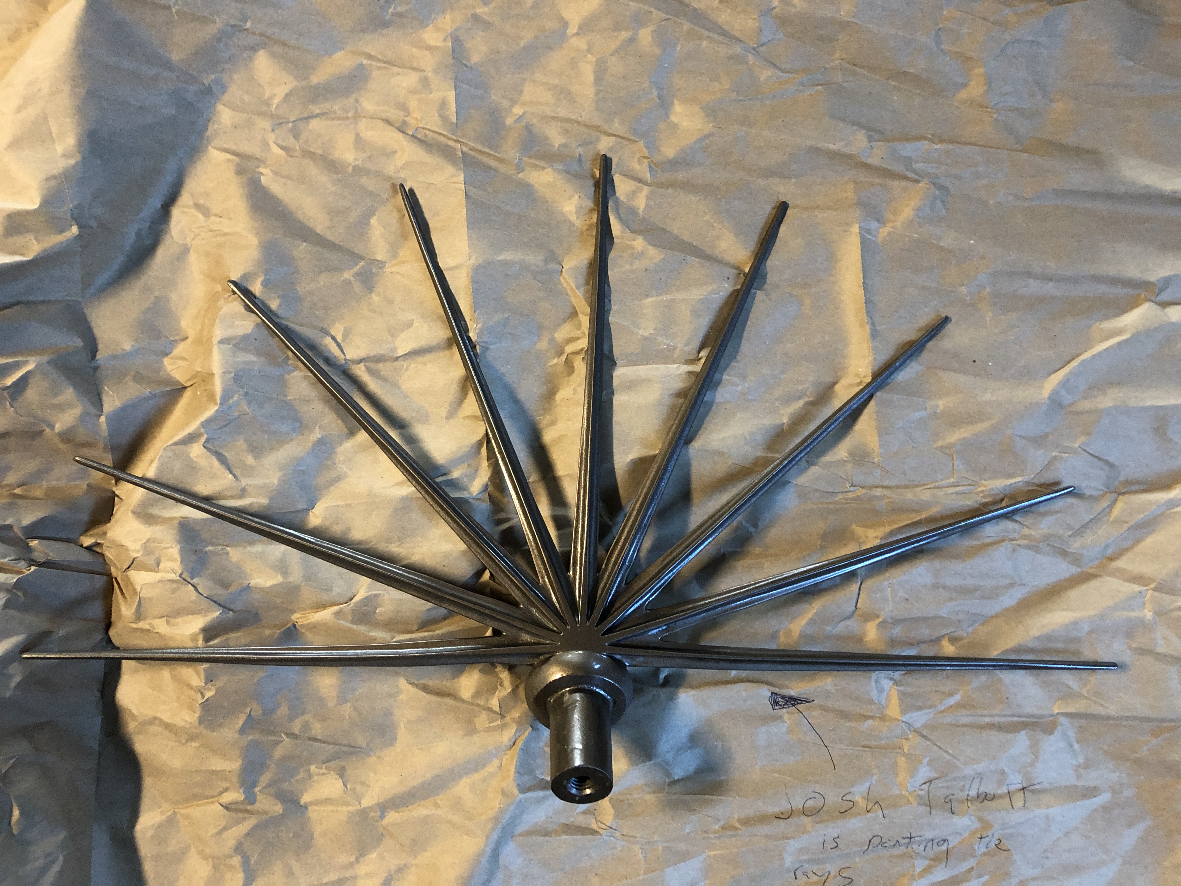The finished crown rays painted to read as bronze and mounted