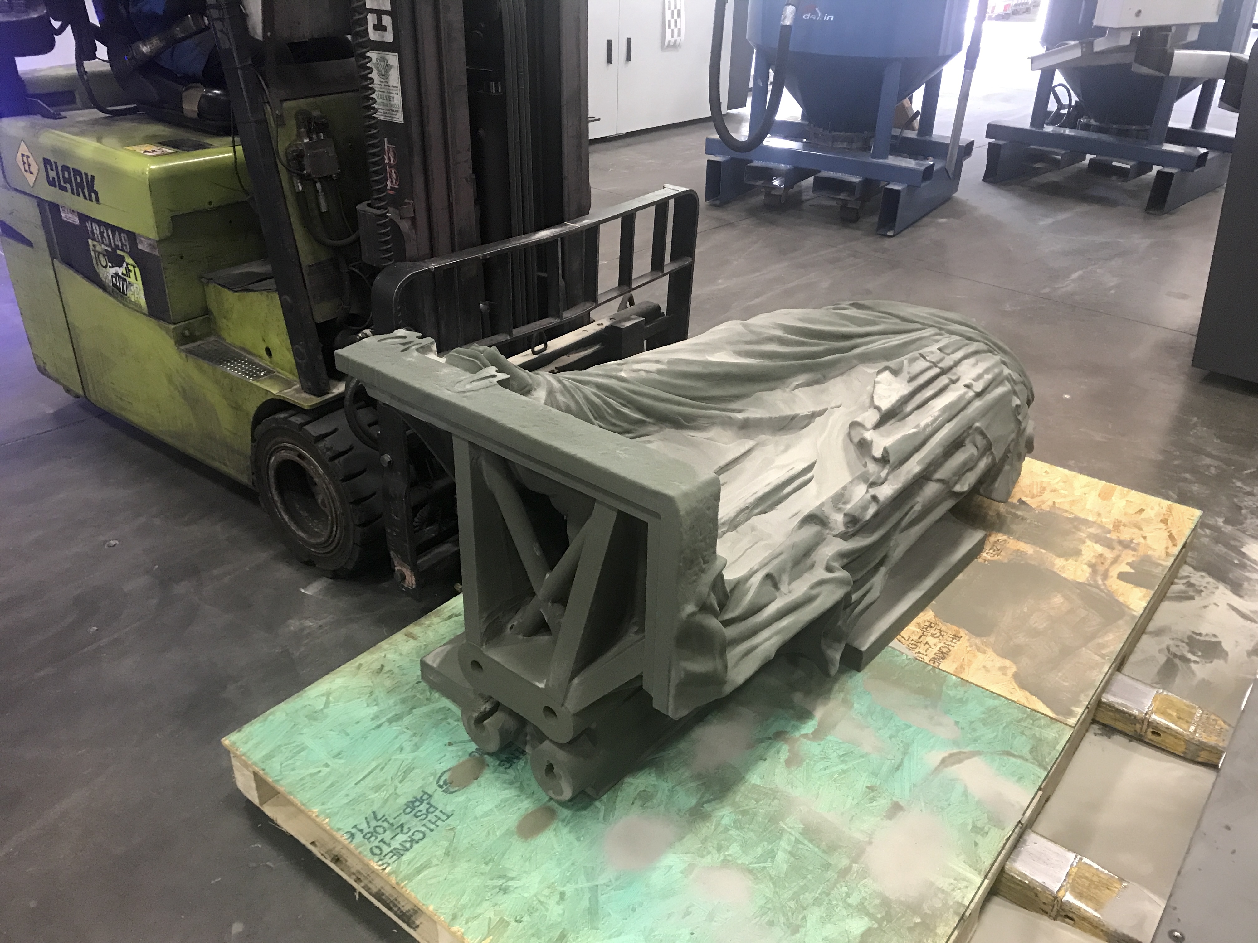 The binder-jet printer and printed part on the shop floor