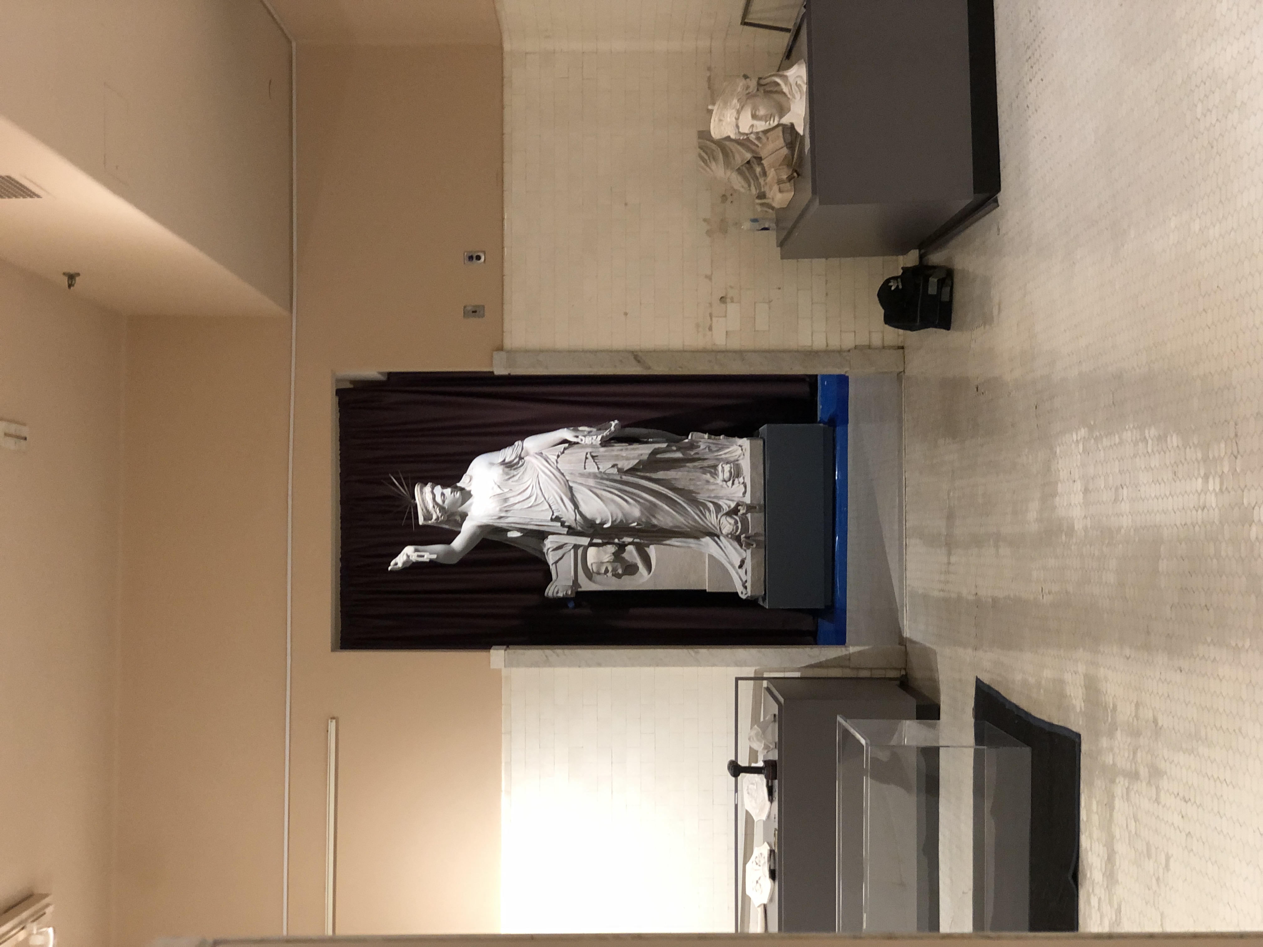 Liberty holding the sightline at the end of the exhibit hall